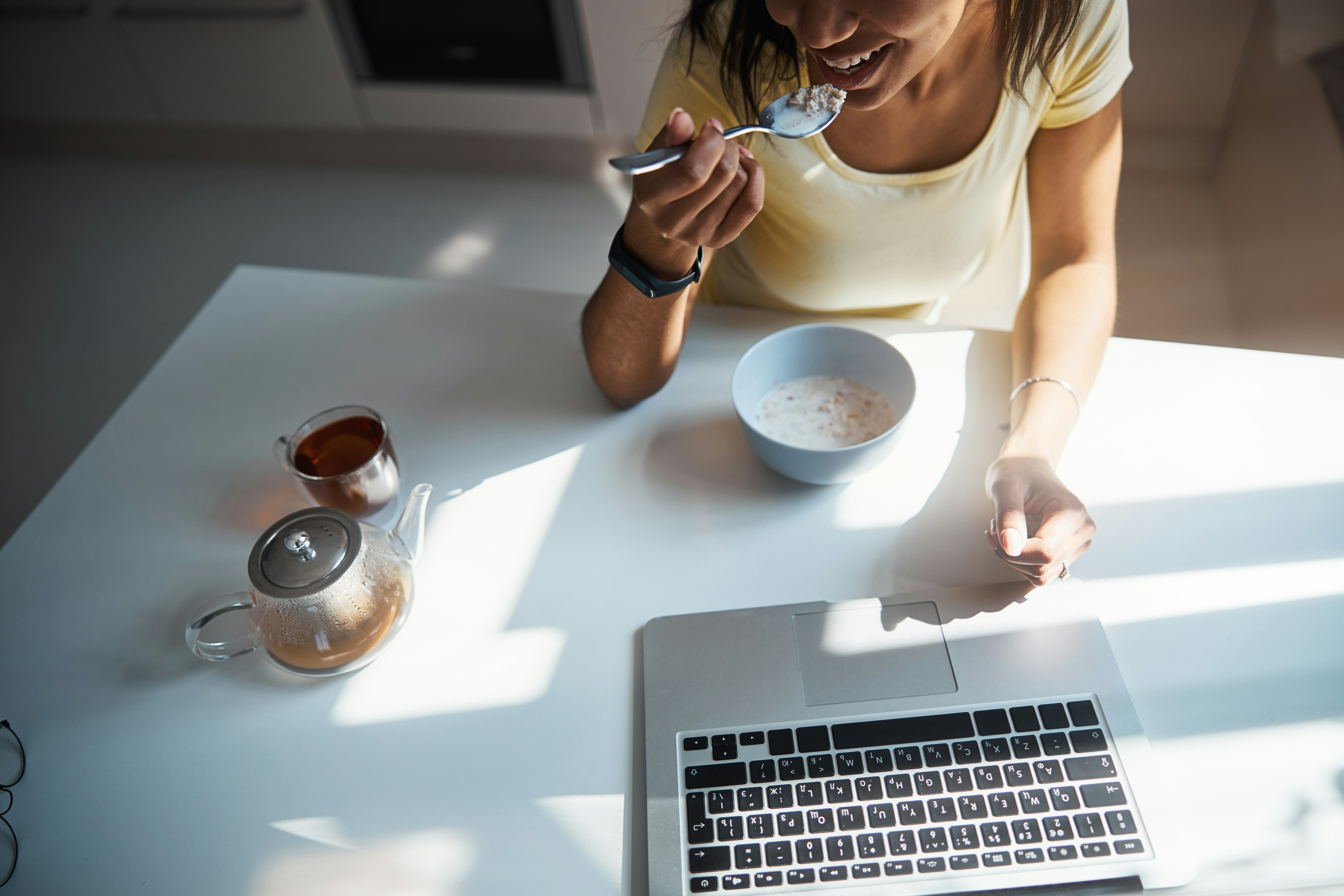 A woman beginning a calm morning routine before work in natural daylight